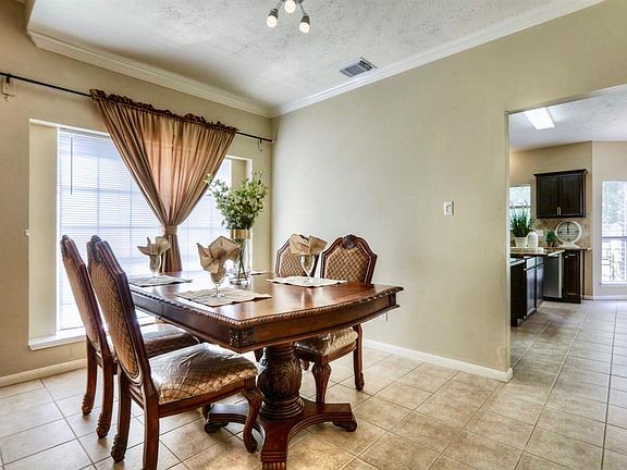 This formal dining room is a breath of fresh air with its elegant design and functional space. Imagine holiday dinners and the a