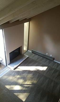 Looking down from second floor to living area - working gas fireplace