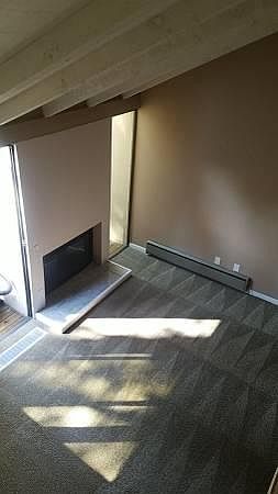 Looking down from second floor to living area - working gas fireplace