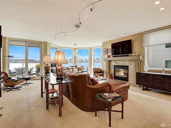 Step inside and you immediately are consumed by the view! This area is definitely the heart of the home - a very appealing great room spacious enough for furniture but still retaining the cozy feel without being cramped.  Always a good feel!