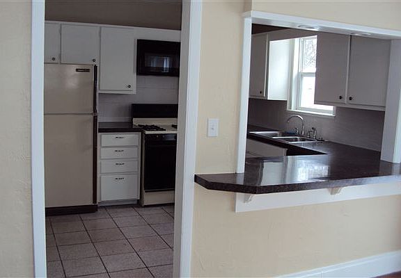 LOOKING FROM DINING INTO KITCHEN
