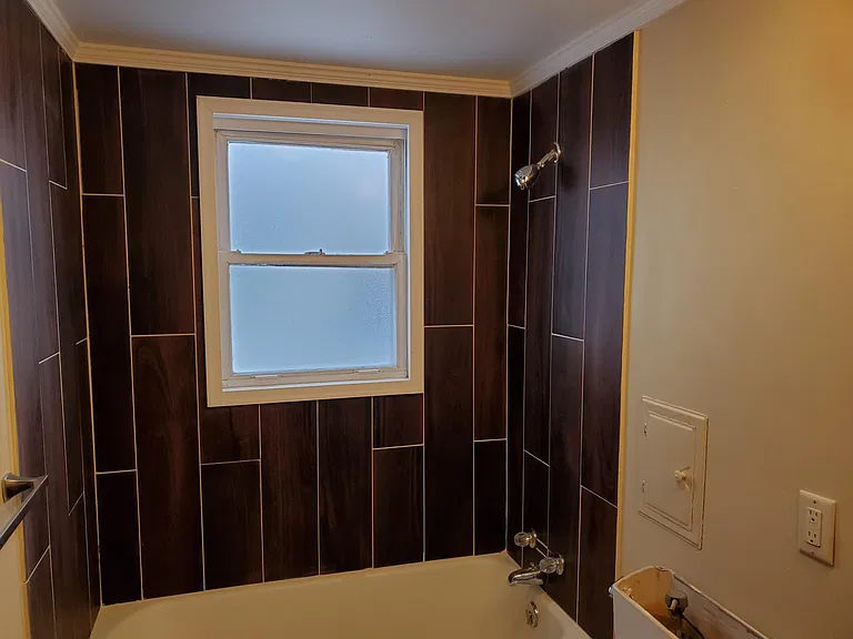 remodeled bath with tub and full shower