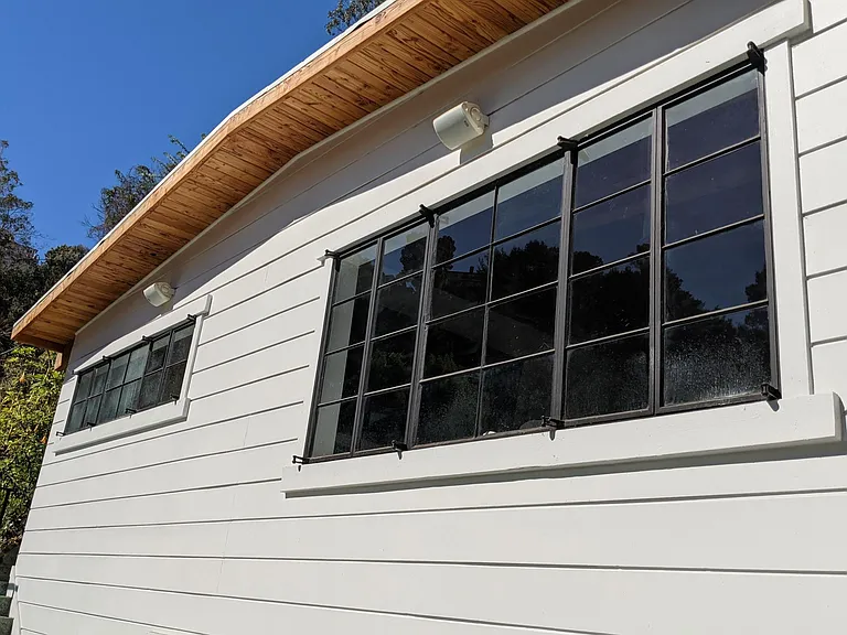 Master Bedroom and LR Windows on Front Facade. Exterior Speakers for Patio.