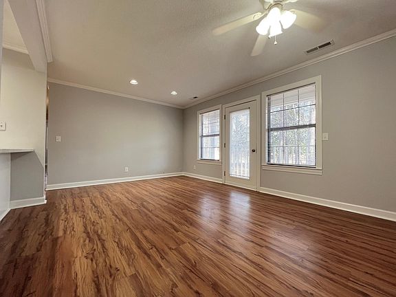 Living room with access to private porch/balcony.