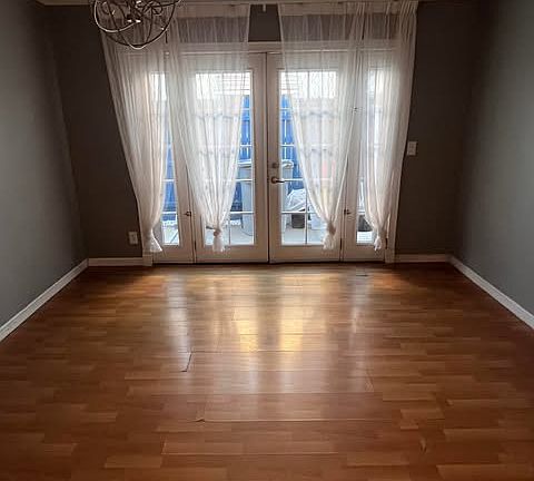 Dinning area with French doors leading to side yard