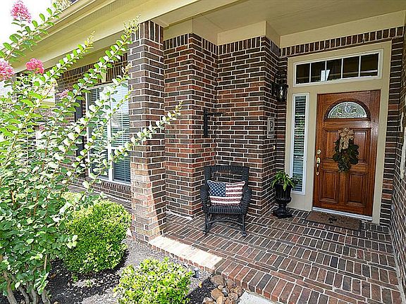Who doesn't love a brick laid front porch? This is awesome.