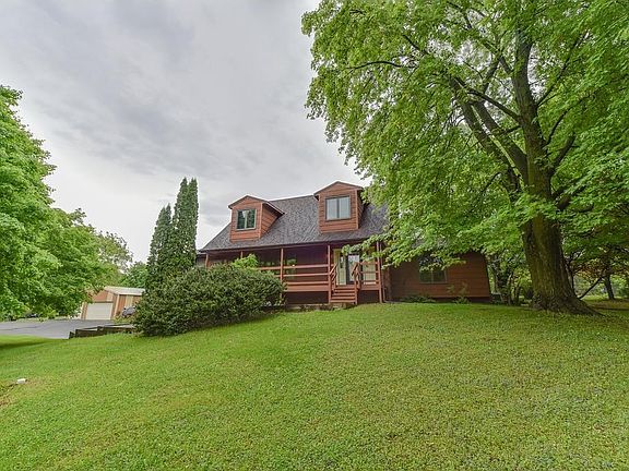 Home sits on a heavily wooded lot.