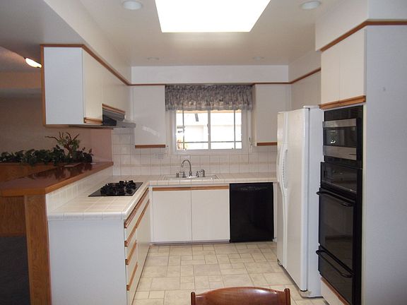 Custom skylight illuminates this practical kitchen
