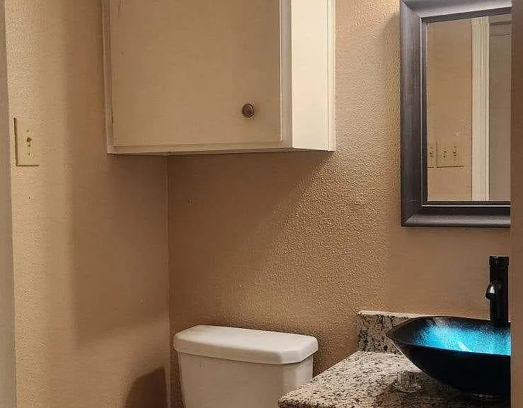 New granite vanity and vessel sink on each side