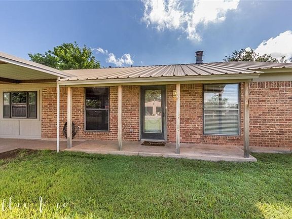 Great front porch to sit and enjoy an evening. Metal roof!