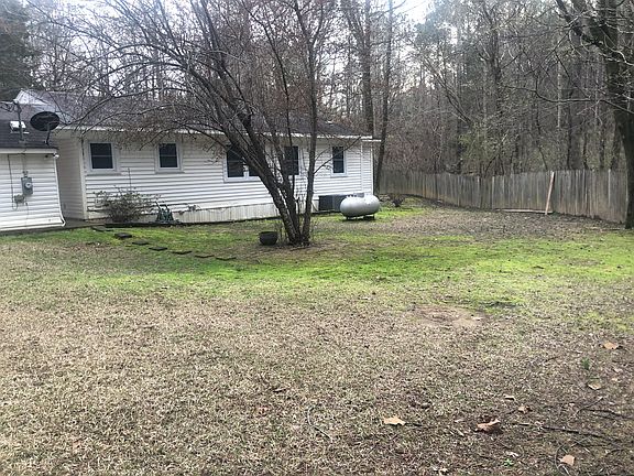 Large fenced backyard where enjoyable family gathering can happen.
