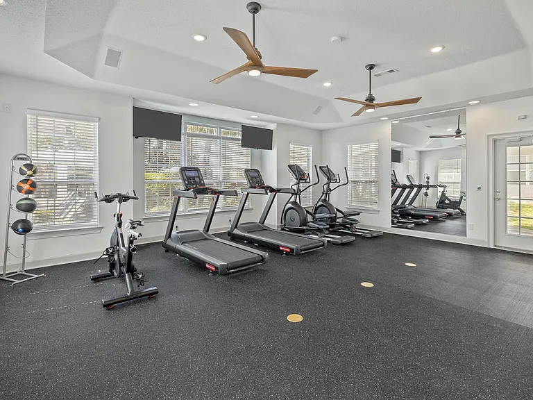 Fully Equipped Fitness Center with Numerous Workout Machines at Theater Street Apartments