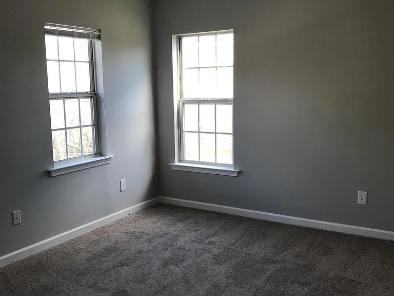 Bedroom with two windows