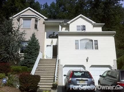 56 Rookwood Terrace, Morris Plains NJ
						:
						Brick + Vinyl Front with 2 Car Garage and space for 2 cards in Driveway