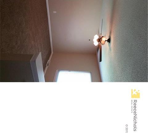 Living room, with NEW carpet, ceiling fan, paint and blinds.