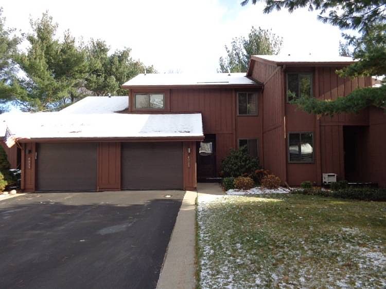 Spacious Sylvan Pines Condo!! Three bedrooms and 2.5 bathrooms. Full basement and attached garage. Convenient location. Association fee $200/month includes water, lawn care, snow removal and exterior maintenance. Park like view from the living room to the back yard. Deck and privacy fence. Plenty of storage.
