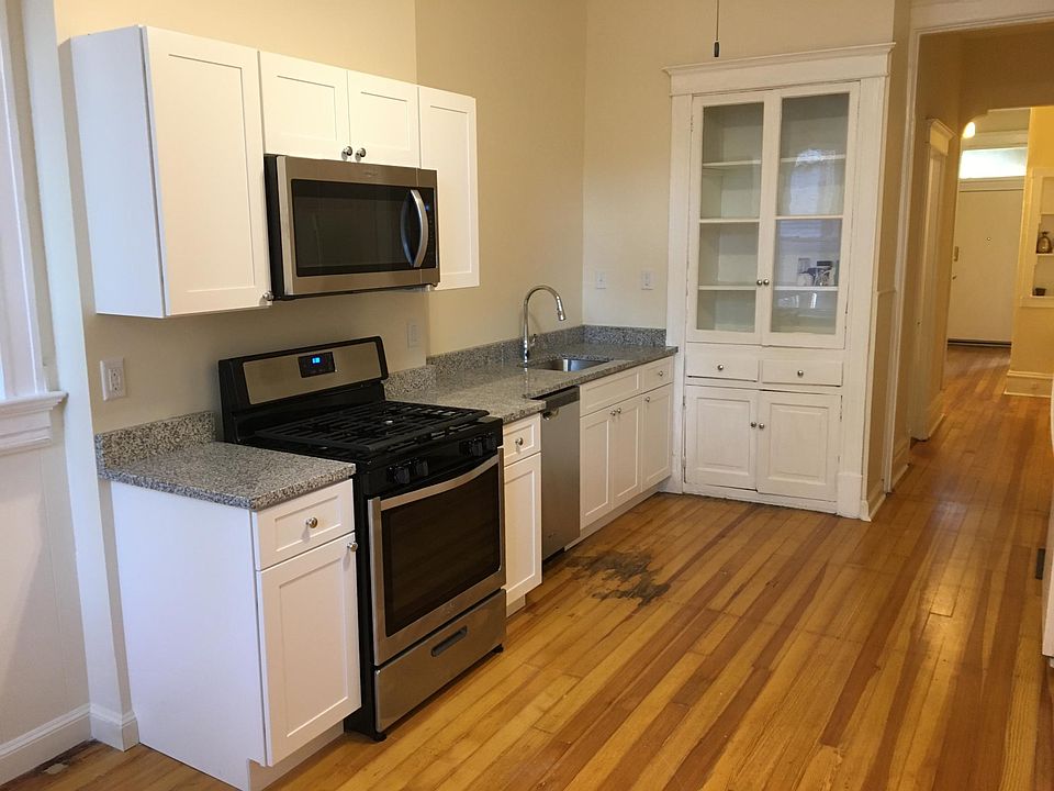 Kitchen with granite countertops and stainless steel appliances.