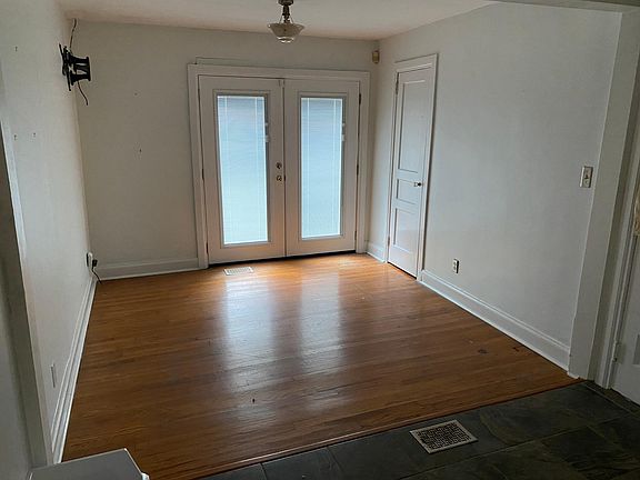 Sunroom with French doors to porch and patio
