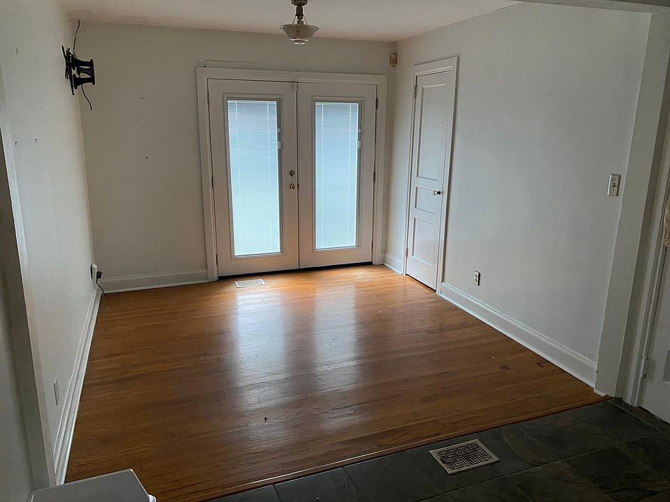 Sunroom with French doors to porch and patio