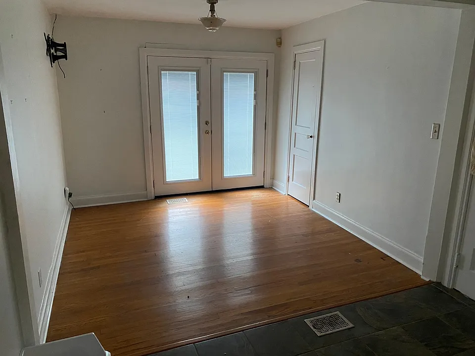 Sunroom with French doors to porch and patio