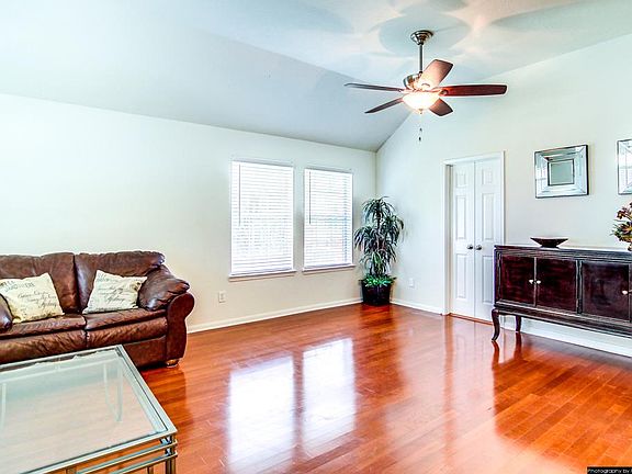 View of the hardwood floor of the formal dinning room and formal living room as you enter the house