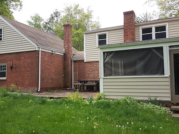 Back of house with patio and 3-seasons room