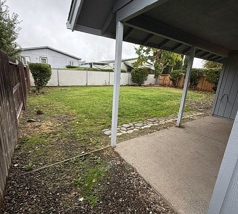 Left side looking at patio and backyard