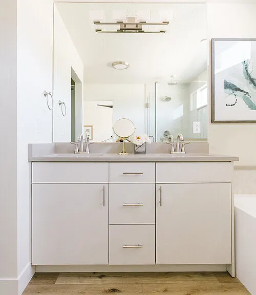 Master bath features quartz countertops, tile shower and bath with separate toilet room