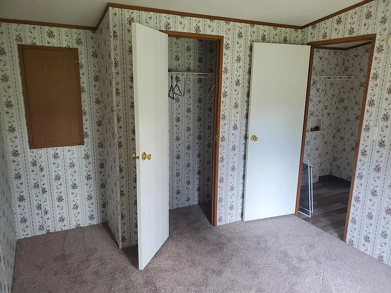 Master bedroom. At far end past the kitchen/bathroom/laundry