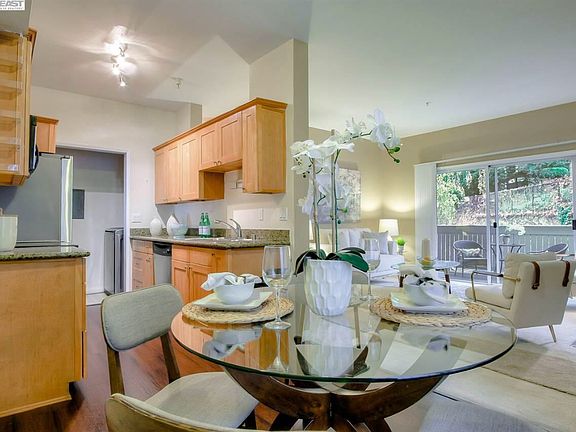 Dining area with staging. The apartment is unfurnished.