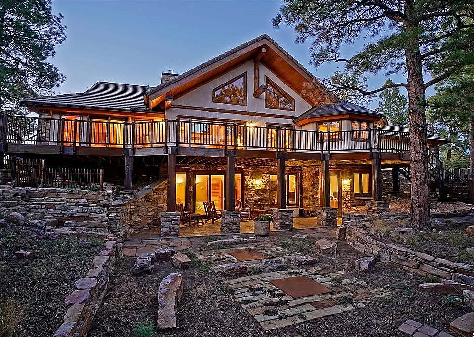 Rear of house with deck and downstairs patio