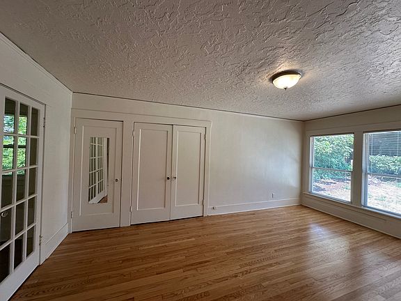 view of main closets and front windows