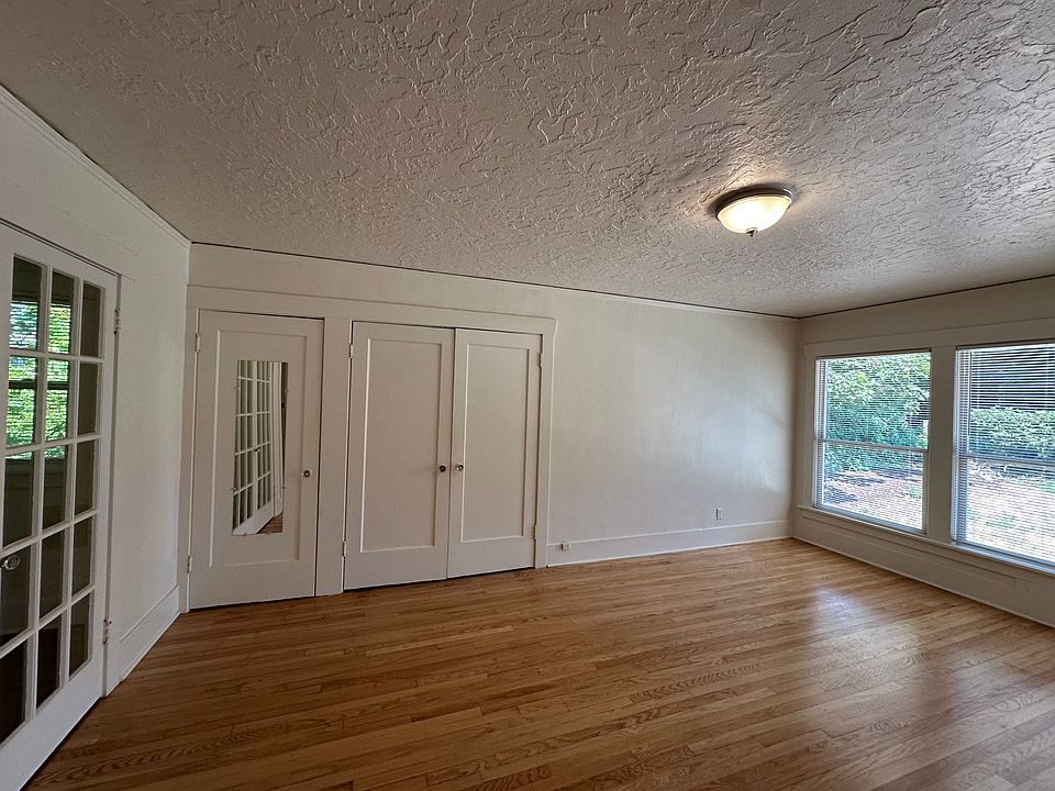 view of main closets and front windows