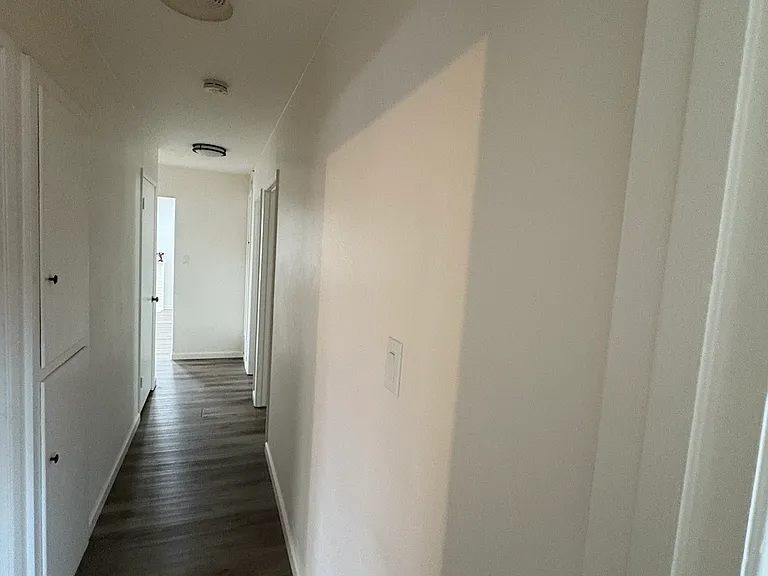 Hallway leading to bedrooms and garage