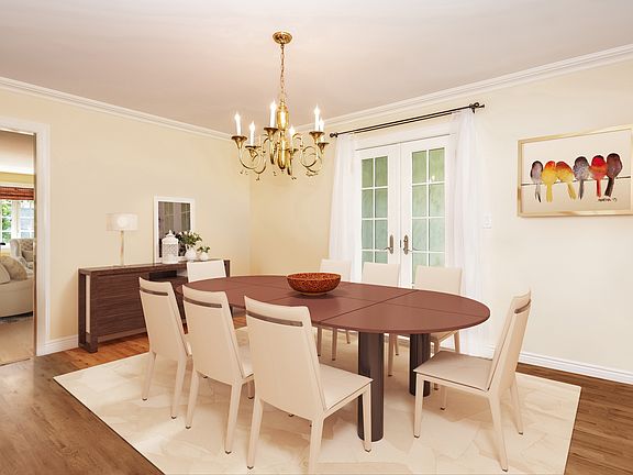 Virtual Staging. Perfectly proportioned dining room with access to a patio and the great room.