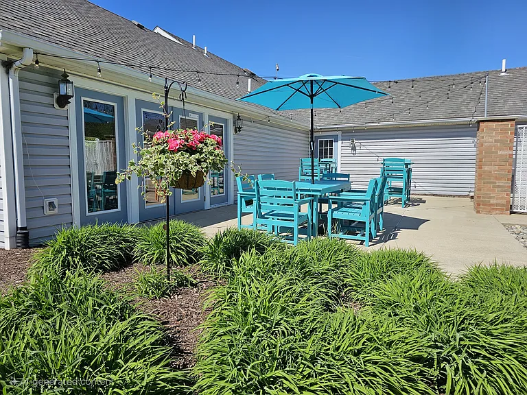 Inviting clubhouse patio with vibrant seatingperfect for relaxing or socializing outdoors.