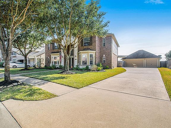 Mature trees offers a shady spot to enjoy the front yard, along with a long driveway leading up to a 3-car detached garage offering plenty of parking for all!