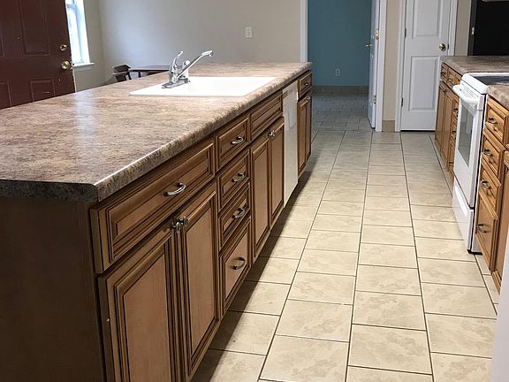 Kitchen includes dishwasher, Side by side fridge, and Smooth top stove