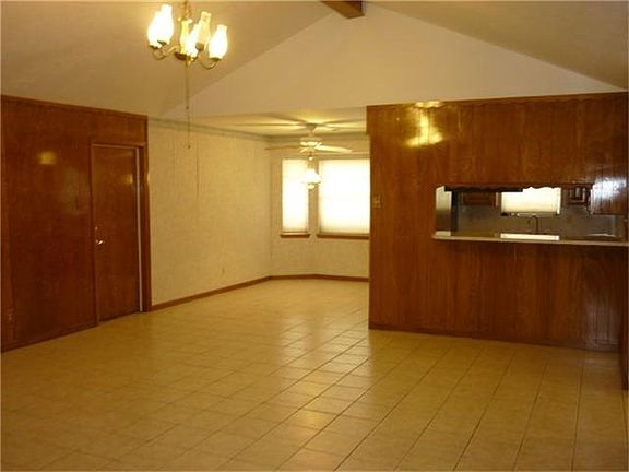 Family room opens to kitchen with breakfast bar & dining area