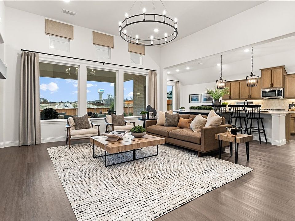 Westlake II one-story floor plan featuring open living spaces, a game room, covered patio, and a pri