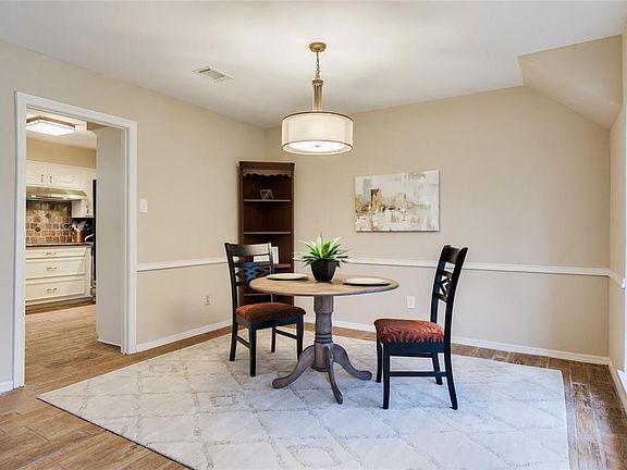 Formal dining room with NEW DRUM CHANDELIER could also be used as a study.