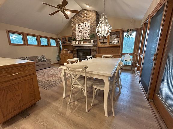 Open concept living/dining/kitchen with a gas fireplace