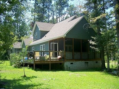 Spacious & private backyard.  Wood deck area & screened in porch.