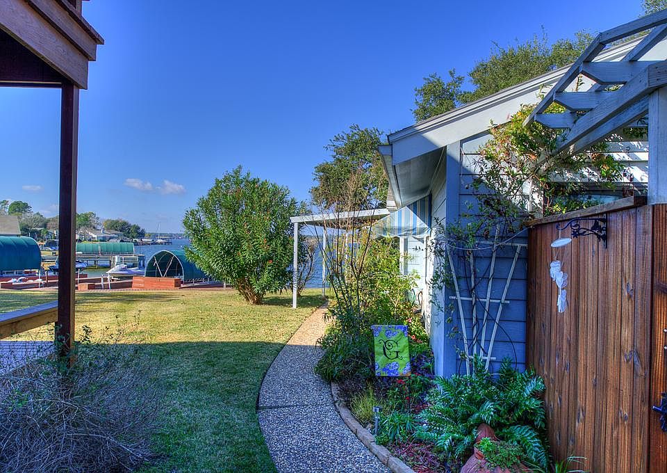 This waterfront retreat is just steps away from your Carport.