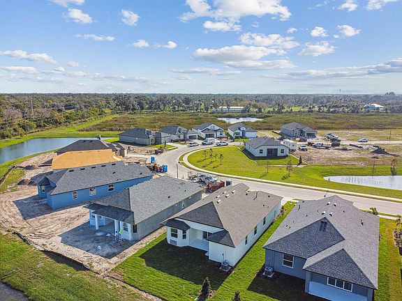 Sweetwater quick move-in new construction home plan elevated rear right view of home at Tea Olive Te