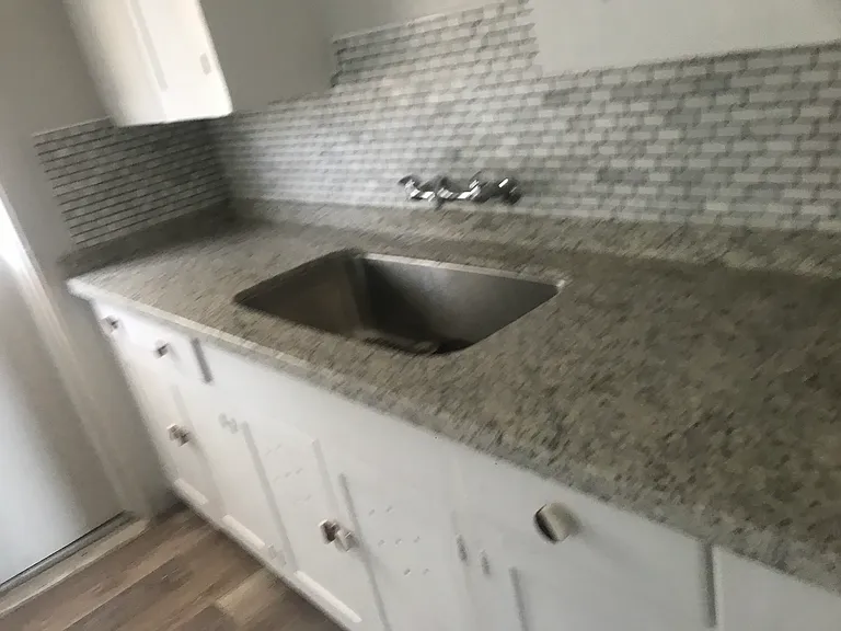 newly tiled granite kitchen, lots of storage and gas stove