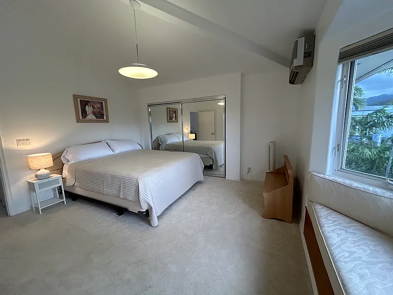 Third bedroom with vaulted ceiling located upstairs facing streetfront