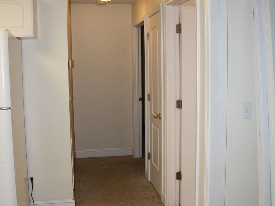 Hallway connects Kitchen and Living area to bedrooms. Washer