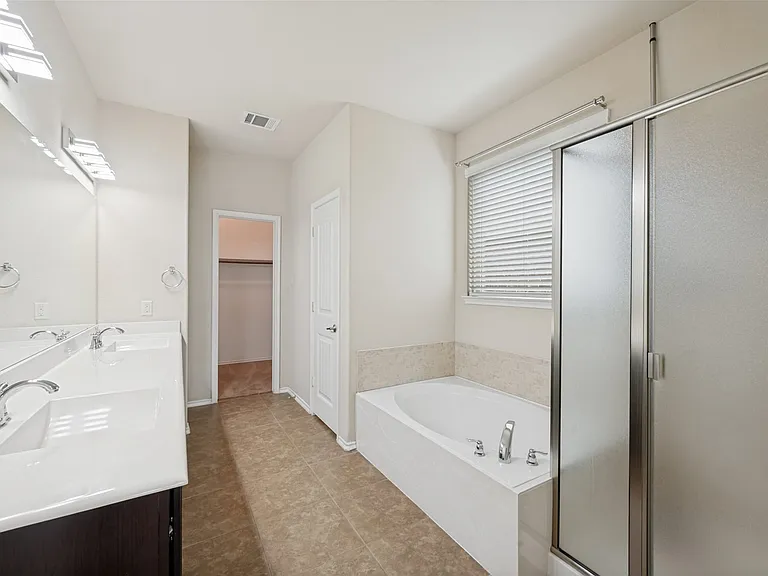 Offers dual sinks, tub and shower