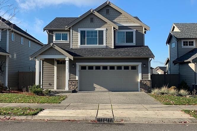 Front of home with parking.
